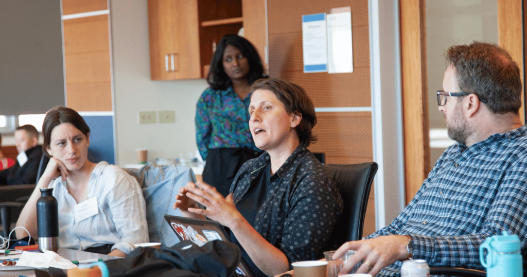 Nicole Starosielski, professor of UC Berkeley talking to a room of researchers.
